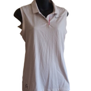 Nike woman's Golf shirt. Size small..Note logo on the bottom.Tiny dots.